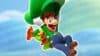 Luigi gliding on his hat with a caterpillar holding onto him in Super Mario Bros. Wonder