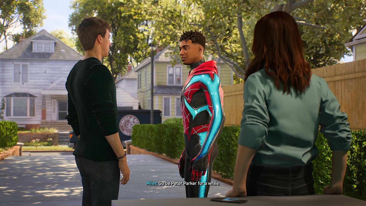 Miles and Peter talking in the garage in Marvel's Spider-Man 2