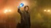 Alan Wake holding a Platinum trophy in Alan Wake 2