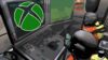 players looking a screen with the xbox logo on it in Lethal Company