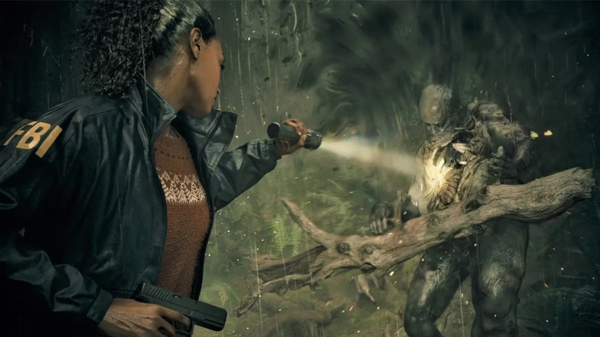 Saga pointing her torch at an enemy in Alan Wake 2
