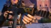 Fortnite character holding a modified weapon in Chapter 5 Season 1