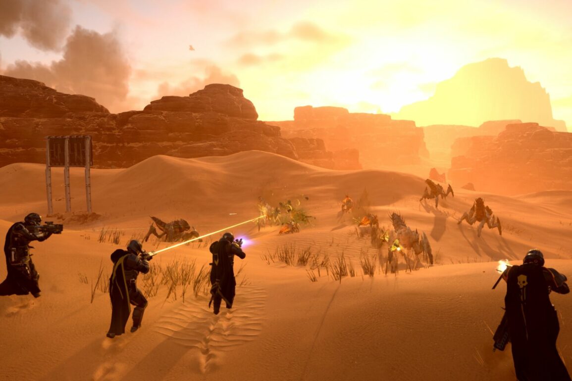 Group of four players shooting Terminids in Helldivers 2