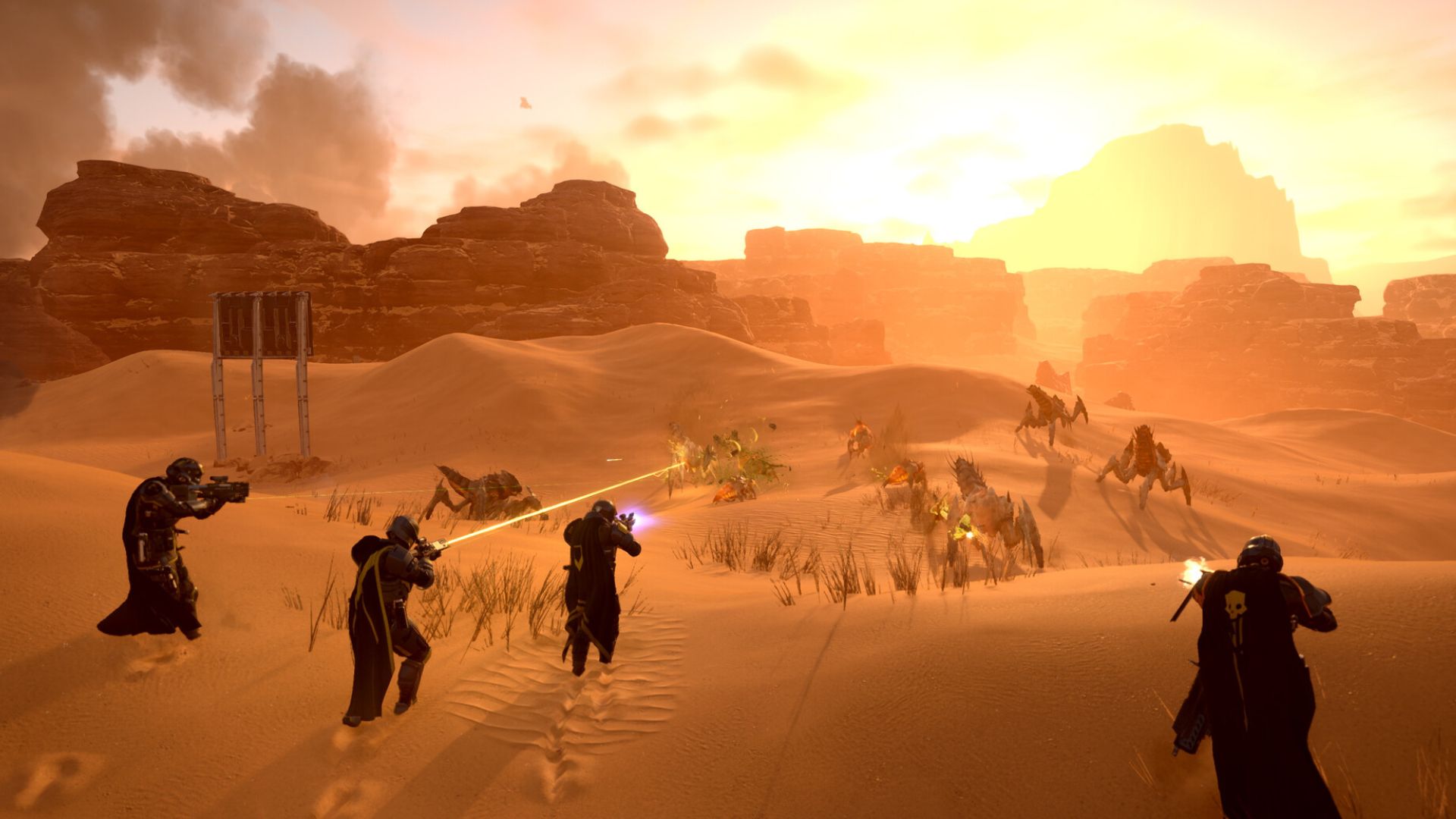 Group of four players shooting Terminids in Helldivers 2