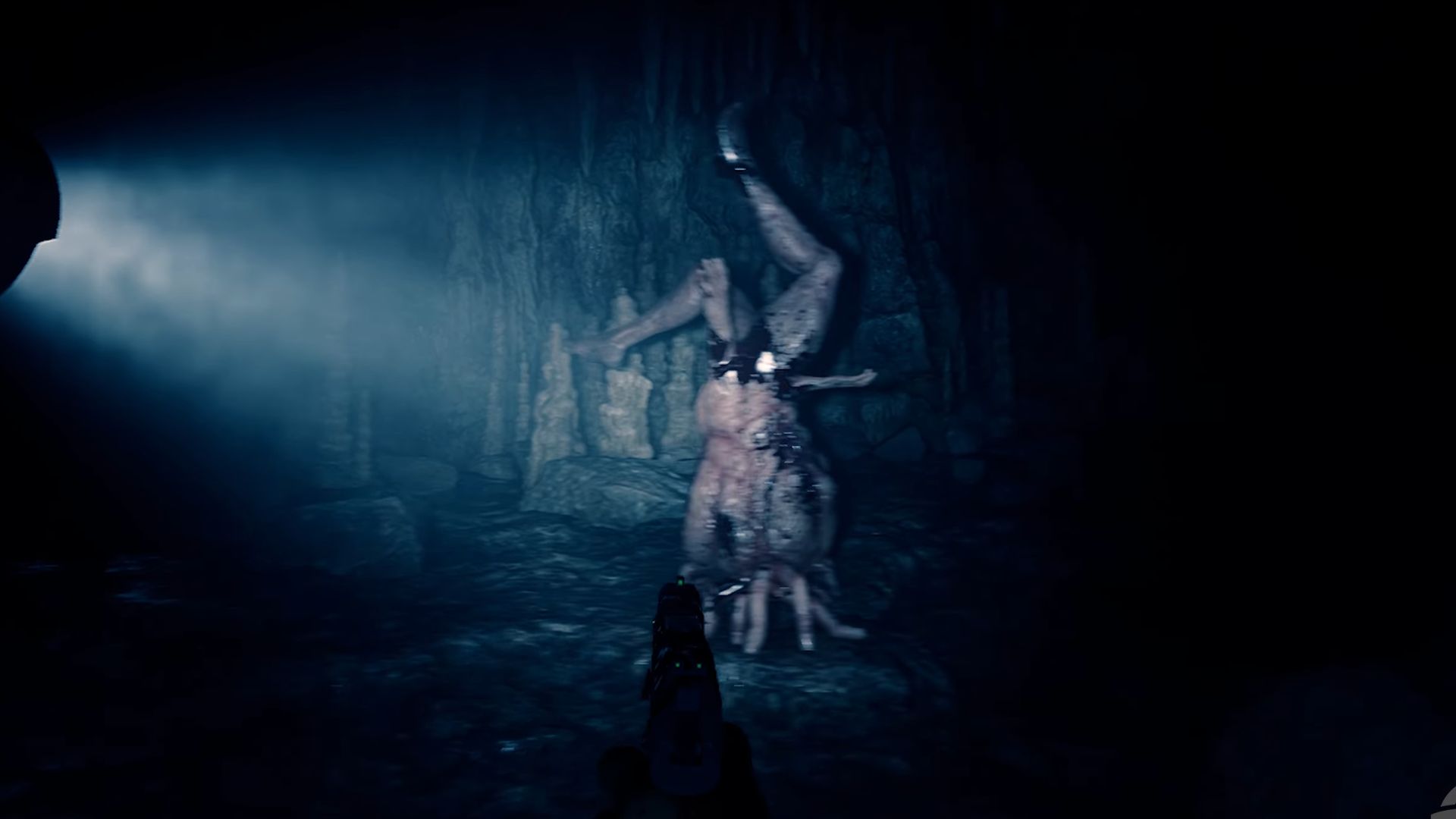 Legsy imitating Stalagmite in a cave in Sons of the Forest
