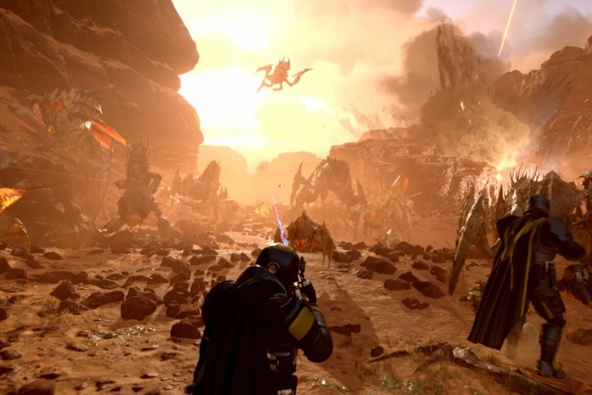 Players shooting Terminids in Helldivers 2