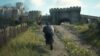 Player walking up to a castle in Dragon's Dogma 2