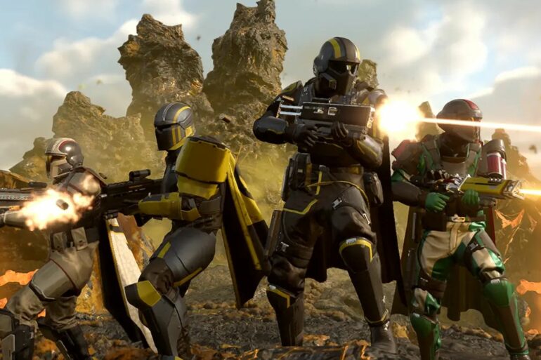 Four Helldivers standing next to each other shooting in Helldivers 2